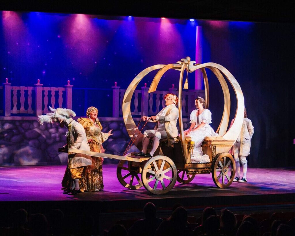 The enchanted carriage with the prince and Ella riding inside